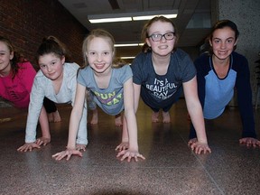 Members of 11-12 year old girls team of the Sudbury Synchronized Swimming club perform dryland training earlier this week. They will compete at the Ontario Winter Games this weekend in Bracebridge and Orillia. The 13-15 year old girls team also qualified to compete. Laura Young/For The Sudbury Star