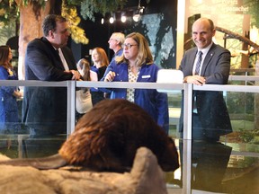 Jean-Yves Duclos, minister of Families, Children and Social Development, right, and Guy Labine, CEO of Science North, look on as staff scientist Amy Henson, of Science North, gives a short tour of the science centre in Sudbury on Thursday. Duclos was in Sudbury highlighting the 2018 federal budget. John Lappa/Sudbury Star/Postmedia Network