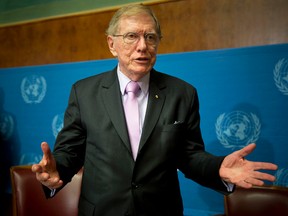 Retired Australian judge Michael Kirby, chairperson of the commission of Inquiry on Human Rights in the Democratic People's Republic of Korea, gestures after delivering the commission's report during a press conference at the United Nations in Geneva, Switzerland, Monday, Feb. 17, 2014. A U.N. panel has warned North Korean leader Kim Jong Un that he may be held accountable for orchestrating widespread crimes against civilians in the secretive Asian nation. Kirby told the leader in a letter accompanying a yearlong investigative report on North Korea that international prosecution is needed "to render accountable all those, including possibly yourself, who may be responsible for crimes against humanity." (AP Photo/Anja Niedringhaus)