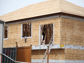 Fort McMurray's Beacon Hill neighbourhood bustling with construction work on the one-year anniversary of the region's evacuation, Wednesday, May 3, 2017. Olivia Condon/ Fort McMurray Today/ Postmedia Network