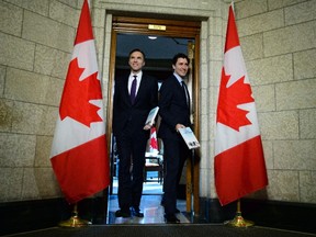 Minister of Finance Bill Morneau walks with Prime Minister Justin Trudeau as they leave his office on route to deliver the federal budget in the House of Commons on Parliament Hill in Ottawa on Tuesday, Feb. 27, 2018. (THE CANADIAN PRESS/Sean Kilpatrick)