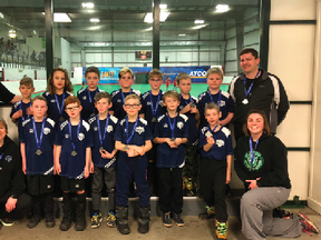 Photo supplied by Stony Plain Celtics
Stony Plain U10 Celtics soccer team pose for a photo alongside their coaches after taking home a silver medal during the 2018 indoor city finals last month.