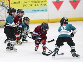Kids in the initiation age category take part in a half-ice scrimmage at a hockey development weekend,  hosted by the Nickel Centre Minor Hockey Association and the Sudbury Minor Hockey Association at the Garson arena in Garson, Ont. on Saturday March 3, 2018. John Lappa/Sudbury Star/Postmedia Network