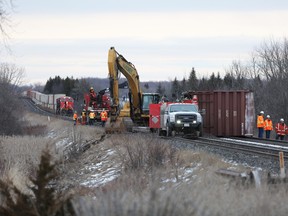 A freight train waits just east of the railway crossing at John F. Scott Road on Saturday, March 3 after two freight cars derailed at 1:20 p.m. on the east end of Kingston, Ont. Meghan Balogh/The Whig-Standard/Postmedia Network