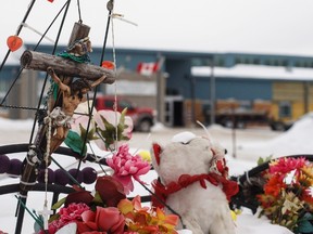 A memorial is shown in front of the school where a teen went on a shooting spree in 2016, in La Loche, Sask. Friday, Feb.23, 2018. A provincial court judge decided the teen who pleaded guilty in the shooting spree, that left four people dead and seven others wounded, will be sentenced as an adult. (THE CANADIAN PRESS/Jason Franson)