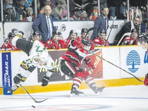 London Knights forward Nathan Dunkley collides with Ottawa 67?s defenceman Merrick Rippon in Ontario Hockey League action Sunday in Ottawa. (Special to Postmedia News)