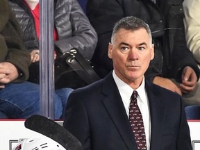 A pensive Kurt Kleinendorst, head coach of the AHL Belleville Senators, ponders his next move behind the bench. (Getty Images)