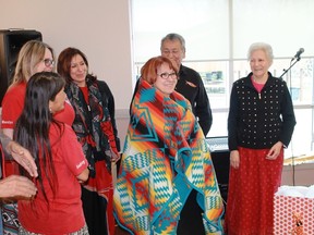 Aamjiwnaang First Nation chief Joanne Rogers receives a blanket during the fourth anniversary celebration of Aamjiwnaang's Heritage and Culture Club, E'Maawizidijig on Feb. 24.
CARL HNATYSHYN/SARNIA THIS WEEK