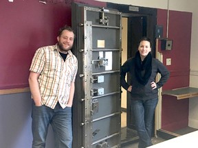 BRUCE BELL/THE INTELLIGENCER
Elliot Reynolds and Laura Borutski are pictured by the vault in Bloomfield’s former CIBC building on Main Street. The couple purchased the building last week and plan on restoring the building and opening a restaurant at the site.