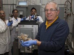 Franco Berruti and his team ?  Mohammad Hossain, left, Sonil Nanda and Frabricio Guayaquil ? use pyrolysis machines to break down waste into oils, gases and char at Western University?s Institute for Chemicals and Fuels from Alternative Resources.  (Derek Ruttan/The London Free Press)