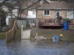 A home at 33 Thomas St. as the street remains completely flooded from the Thames River in Chatham, Sunday, February 25, 2018. (DAX MELMER/Postmedia Network)