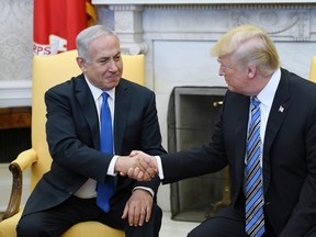 U.S. President Donald Trump shakes hands with Israel Prime Minister Benjamin Netanyahu. (Getty Images)