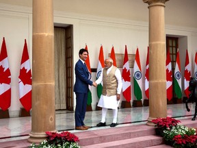 Indian Prime Minister Narendra Modi, right, shakes hand with his Canadian counterpart Justin Trudeau before their meeting in New Delhi, India. (AP Photo)