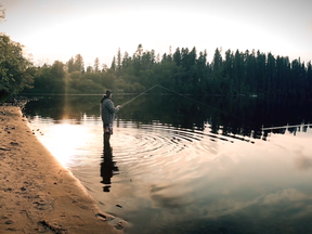 A man fishing at the Moose Lake reserve area appears in a still from a film produced by the Fort McKay First Nation and uploaded to Vimeo on November 14, 2017.