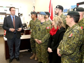 Kingston and the Island member of Parliament Mark Gerretsen speaks with Kerri Tadeu and soldiers from CFB Kingston on Tuesday who assisted in cleaning up the on and off ramps of the Highway of Heroes between Quinte West and Toronto. (Ian MacAlpine/The Whig-Standard)