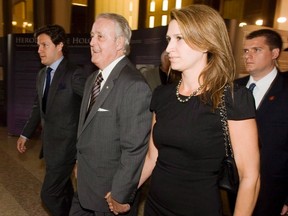 Former prime minister Brian Mulroney, second from left, his son Mark, left, and daughter Caroline. (THE CANADIAN PRESS)