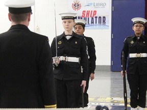 Taryn Daly, left, Sreya Liju and Maria Jacinto listen as Lt. (N) Brad Brooker addresses the Sarnia Sea Cadet corps. The Royal Canadian Sea Cadet Corps "Repulse" held an open house Tuesday to attract new members. Tyler Kula/Sarnia Observer/Postmedia Network