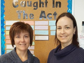 Kim Carriere, left, educational assistant at Pius XII School, presents a cheque to Jennifer Hughes, animal centre manager at the SPCA. Supplied photo