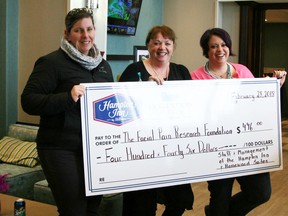 Hampton Inn and Homewood Suites staff and management made a donation to the Facial Pain Research Foundation. Supplied photo