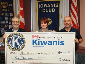 Deker Bauer Foundation CEO Teresa Ingles receives a cheque for $4,000 from Sarnia-Lambton Golden K Kiwanis members Dick Felton and Allan McKeown following her Feb. 27 presentation.
CARL HNATYSHYN/SARNIA THIS WEEK