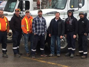 Submitted photo
A crew of seven Veridian Connections workers, including Belleville Field Supervisor Joe Lonsberry (third from right) and Belleville linesmen Jeff O'Neil (second from right) and Justin Henriquez (right), are in Connecticut this week helping Eversource, New England's largest energy company, repair electrical infratructure and restore power to thousands affected by last Friday's massive nor'easter storm. A second fierce storm was lashing the U.S. east coast Wednesday.