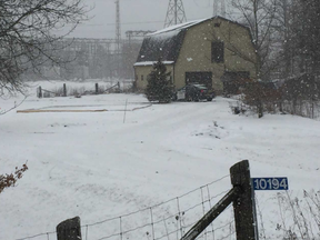 Human remains were found on farmland behind this building on Turner Road northwest of St. Thomas. Police are investigating. (Derek Ruttan/The London Free Press)