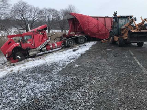 A westbound transport truck crashed Thursday morning after its driver lost control on Highway 401 west of London, near Iona Road, police say. The truck was hauling metal filings and spilled its load when it crashed just before 6 a.m. A 45-year-old Kitchener man is charged with careless driving. (OPP photo)