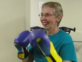 Carolyn Young, with the Sarnia-Lambton Parkinson's Support Group, takes part in a Rock Steady Boxing program at Ironworks Fitness in Point Edward for those living with Parkinson's disease. The Parkinson Society of Southwestern Ontario is holding a conference April 25 in Point Edward on mental health and Parkinson's. (Paul Morden/Sarnia Observer/Postmedia Network)