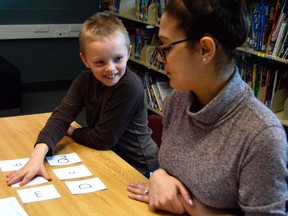 Joseph Robinson, left, matches sounds and letters with ease during a game of Simon Says at Forest Park Public School in St. Thomas. The game is part of a ten-week program called Strong Start, being piloted this spring at the Thames Valley District School Board. (Louis Pin // Times-Journal)