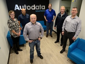 The executive team at Autodata Solutions ? Mary Holbrook, left, director of human resources, Keith Murray, chief operator, Chris Wedermann, chief information officer, Hans Otten, vice-president of architecture, Greg Perrier, chief executive, and Neal James,chief financial officer ? show off the firm?s new digs in the Bell building downtown. (MORRIS LAMONT/THE LONDON FREE PRESS)