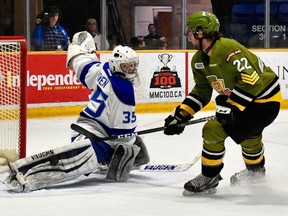 Sudbury Wolves goalie David Bowen stretches out the right pad to make a stop on North Bay Battalion winger Jake Henderson during the second period of OHL action at Memorial Gardens in North Bay, Thursday, March 8, 2018. Tom Martineau/For Postmedia Network