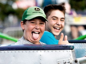 Riley Filiatraut, 11, and Teaken Brazeau, 12, of North Bay enjoy a midway ride at Summer in the Park in 2016.
Nugget File Photo
