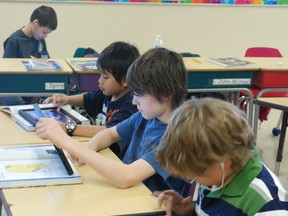 The Lambton Kent District School Board will continue giving seventh graders iPads every year, despite a $300,000 to $400,000 grant cut from the Ontario Ministry of Education that helped fund the program. File photo/Postmedia Network