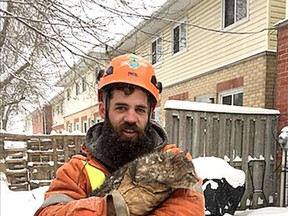 John Madden, from Eco Tree Service, rescued a cat in tree in Kingston. Handout photo.