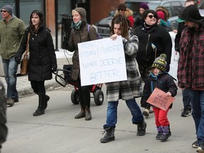 Kingston students, residents and representatives from a number of local organizations came together for a rally to mark International Women’s Day and to demand equality for women of all walks of life. (Meghan Balogh/The Whig-Standard/Postmedia Network)