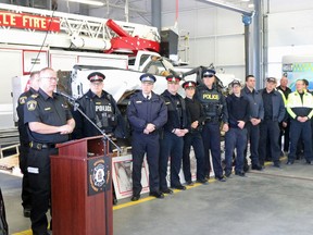 BRUCE BELL/THE INTELLIGENCER
Fire prevention officer Carson Cross speaks about the stop texting vehicle the local fire department gave to the Ontario Provincial Police on Monday morning. The gift coincided with the OPP March Break road safety campaign. He is joined by members of the OPP, Belleville Police Service, Hastings Quinte Paramedic Services and the Belleville Fire Department.