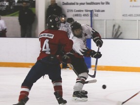 Vulcan midget Hawk Will Smith shoots during the second period of the Hawks’ Central Alberta Hockey League playoff game against Lethbridge on Saturday at the Vulcan District Arena. The Hawks lost 5-1, eliminating them from the league playoffs. Jasmine O’Halloran Vulcan Advocate