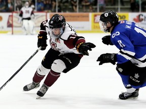Chatham Maroons' Josh Supryka (18) is chased by London Nationals' Mitchell Webb (13) in the second period at Chatham Memorial Arena in Chatham. (Mark Malone/Postmedia Network file photo)