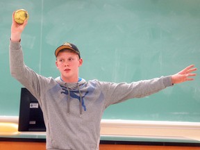 Adam Van Maanen, talks about how to throw a softball, during the Chatham-Kent 4-H public presentation night at Ridgetown College on March 8. Van Maanen was one of a dozen 4-H members who made public presentations on a variety of topics. David Gough/Postmedia Network