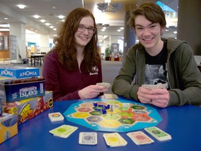 Project Play volunteers and London Library staff members celebrate the introduction of board game lending following a donation of more than 170 games. (Photo submitted)
