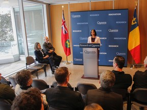 Madhuri Koti, one of three Early Researcher Award grant recipients, speaks to the crowd gathered at the major funding announcement in the lobby at the Queen's University Cancer Research Institute in Kingston on Wednesday. (Julia McKay/The Whig-Standard)