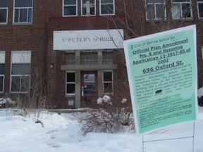 A planning notice is posed outside the former St. Peter Catholic School in Sarnia, where a developer is planning to create a retirement project. The developers have applied for planning and zoning changes to be heard Monday by city council. (Paul Morden/Sarnia Observer/Postmedia Network)