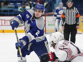 Doug Blaisdell, left, of the Sudbury Wolves, fires the puck on net during OHL action against the Oshawa Generals at the Sudbury Community Arena in Sudbury, Ont. on Friday February 16, 2018. John Lappa/Sudbury Star/Postmedia Network