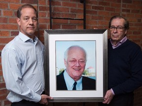 The executors of a Kingston man's will are in a dispute with the Canadian Cancer Society over their request that a major portion of a multimillion-dollar bequest to the charity be directed towards research into pancreatic cancer, one of the deadliest of all malignancies. Jason Clark, left, and Walter Viner pose with a picture of the late Bob Clark in Kingston, Ont., on Tuesday, March 13, 2018. THE CANADIAN PRESS/Lars Hagberg