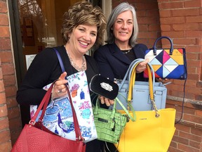 Donna Dwyre,manager resource development for Hospice Kingston, left, and Jane Lapointe, financial advisor/partner at Assante Financial,  show off some of the handbags that will be available at the Handbags for Hospice event on Wednesday March 21 2018 at the CAtaraqui Golf and Country Club in Kingston. Ian MacAlpine/The Whig-Standard/Postmedia Network