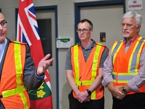 Steven Del Duca, Ontario minister of economic development and growth, announces grants for five businesses in Chatham-Kent under the Southwestern Ontario Development Fund at Dana Canada's Chatham facility on Thursday. Also shown are plant manager Michael Faber and Chatham-Kent-Essex MPP Rick Nicholls. Tom Morrison/Chatham This Week