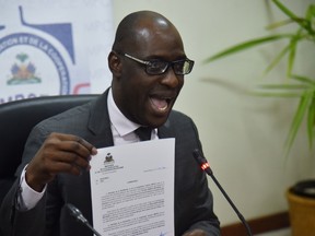 Minister of Planning and External Cooperation, Aviol Fleurant speaks to the media after a meeting with Oxfam Regional Director for Latin America and the Caribbean, Simon Ticehurst, in Port-au-Prince, on February 22, 2018.
Haiti on February 22, 2018 suspended Oxfam's operations pending the outcome of its investigation into allegations that staff of the British charity sexually exploited Haitians after a devastating 2010 earthquake. The country's ministry of planning and foreign aid said Oxfam had made a "serious error" by failing to inform Haitian authorities of the actions by their staff at the time they occurred.
 / AFP PHOTO / HECTOR RETAMALHECTOR RETAMAL/AFP/Getty Images