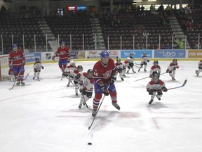 A group of Sarnia youth chase Montreal Canadiens alumn Stephane Richer for the puck during a benefit hockey game played at Progressive Arena on March 2. The Canadiens Alumni Tour was in Sarnia to raise money for the Deker Bauer Foundation for Suicide Prevention.
CARL HNATYSHYN/SARNIA THIS WEEK