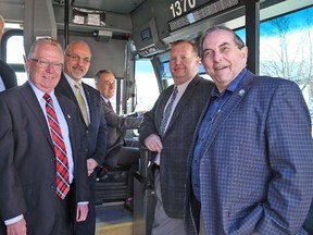 TIM MEEKS/THE INTELLIGENCER
Bay of Quinte area transit systems received a huge boost from the federal and provincial governments Friday, with nearly $16.6 million in infrastructure funding announced. Celebrating the windfall were, from the left: Quinte West Deputy Mayor Jim Alyea, Prince Edward County Mayor Robert Quaiff, Belleville Mayor Taso Christopher, Bay of Quinte MP Neil Ellis, Belleville Manager of Transit Operations Paul Buck and Belleville Coun. Garnet Thompson.