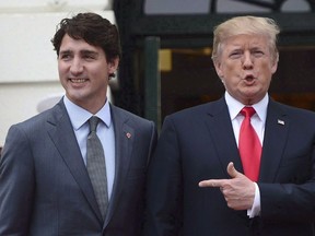 U.S. President Donald Trump boasted in a fundraising speech in Missouri on Wednesday that he made up facts about trade in a meeting with Prime Minister Justin Trudeau, according to a recording of the comments obtained by The Washington Post. Prime Minister Justin Trudeau is greeted by U.S. President Donald Trump as he arrives at the White House in Washington, D.C., on October 11, 2017. THE CANADIAN PRESS/Sean Kilpatrick